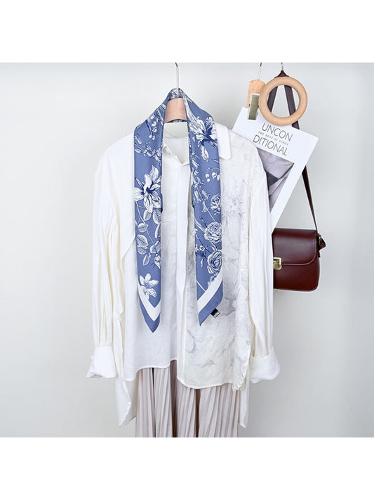Scarvii square scarf with colorful floral print laid flat
