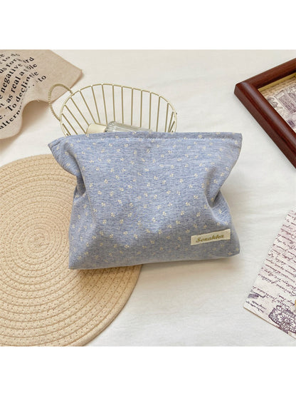 Cosbai vintage tiny flower cosmetic pouch placed next to makeup brushes