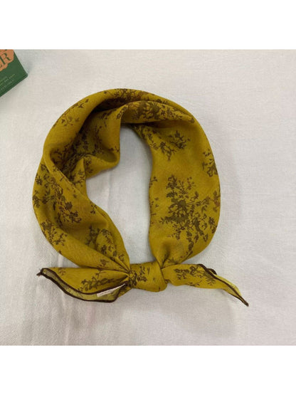 Model showcasing Scarvii Baroque Floral Square Scarf tied around the neck with elegant floral design