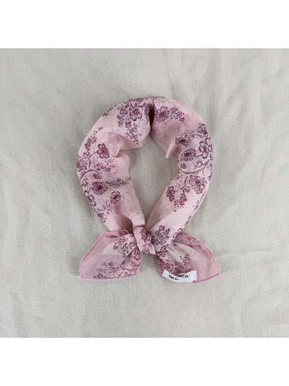 Soft Blossom Print Scarf folded showing pastel floral pattern on light fabric