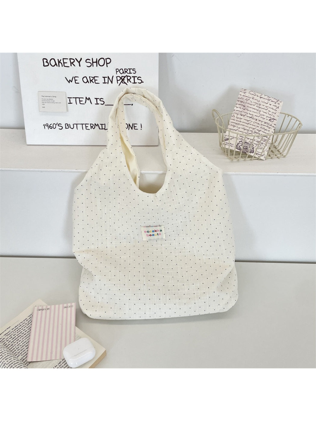 Side view of Cosbai soft polka dot shoulder tote bag showing strap and dot pattern