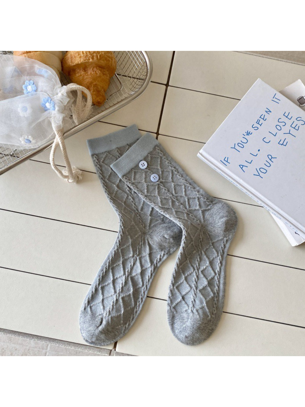 Model wearing Rufia Sweet Blue Grey crew socks paired with casual shoes