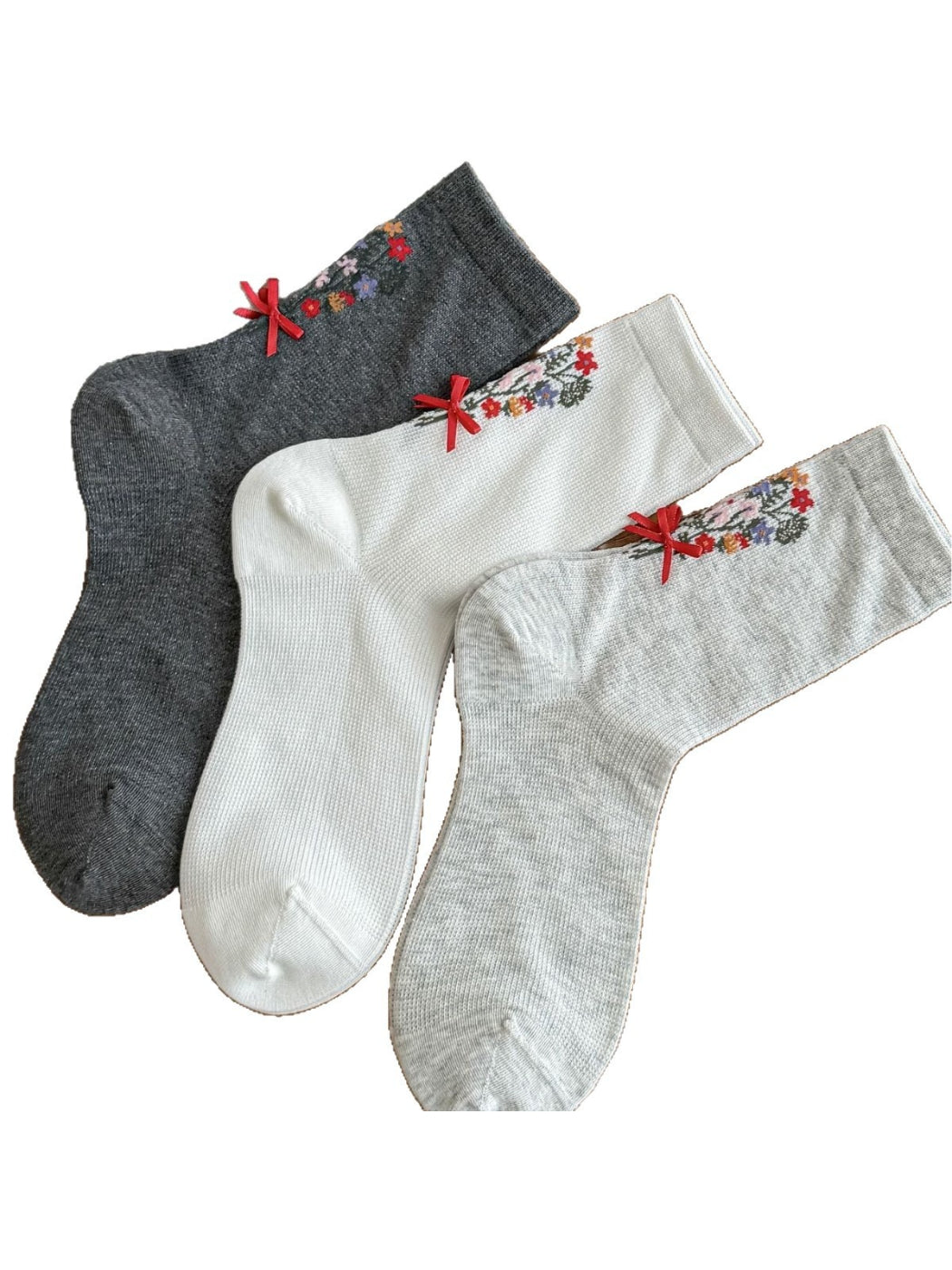 Rufia floral bow ankle socks worn on feet showing ankle profile