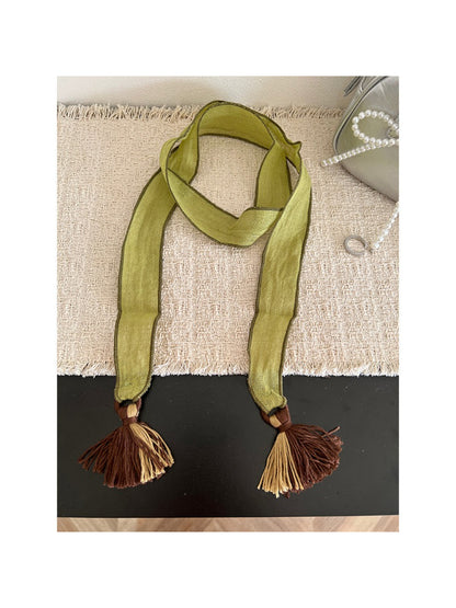 Model wearing Scarvii boho skinny scarf styled around the neck