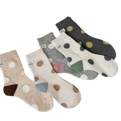 Close-up of Rufia socks showing black heel and toe with white body and black dots