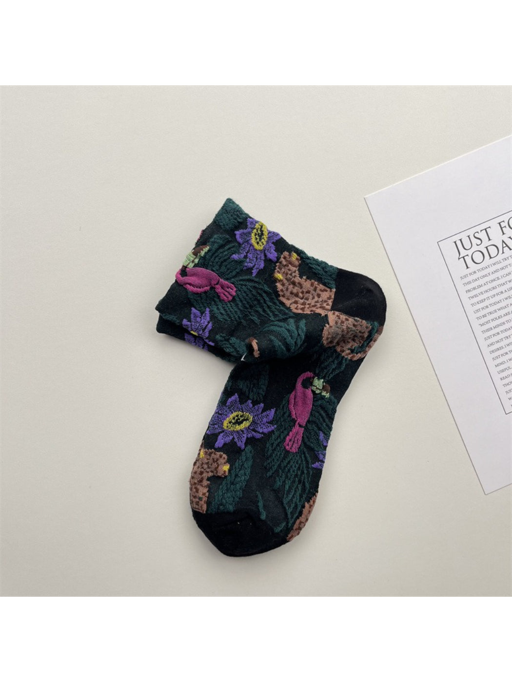 Close-up of Rufia embossed floral mid-calf socks