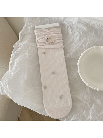 Rufia socks folded neatly showing the animal detail pattern and brand tag