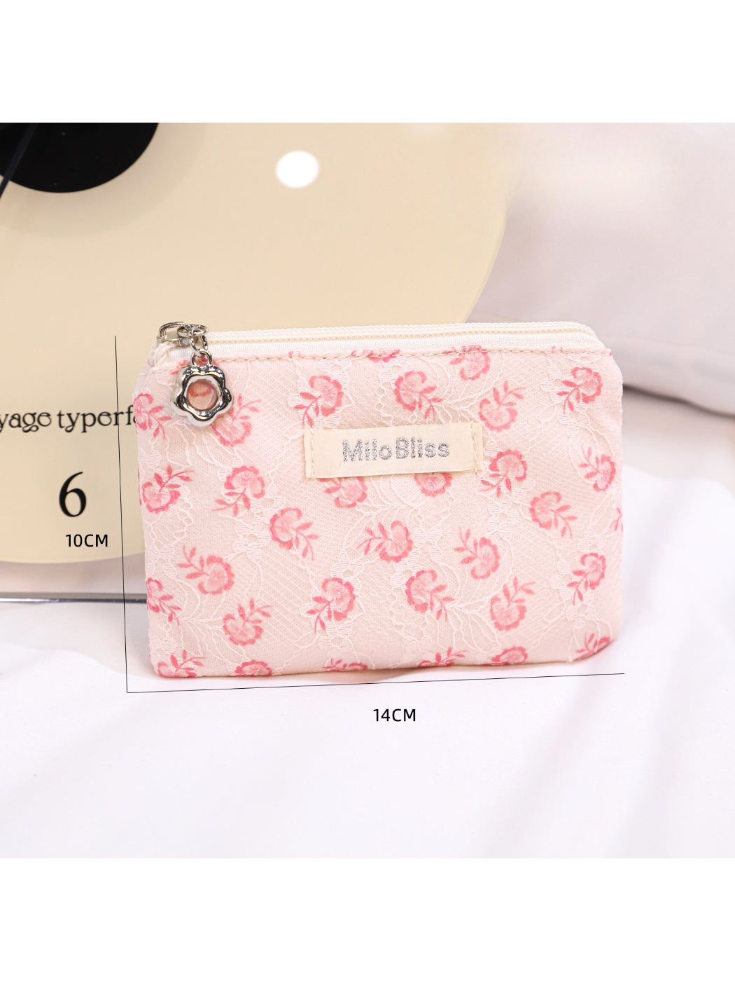 Cosbai floral coin purse lying flat showing full floral pattern and shape
