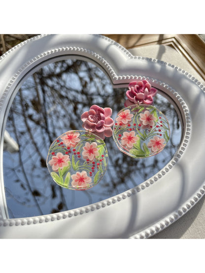 Earwish Garden Flower Disc Earrings worn by a model with short hair and neutral makeup