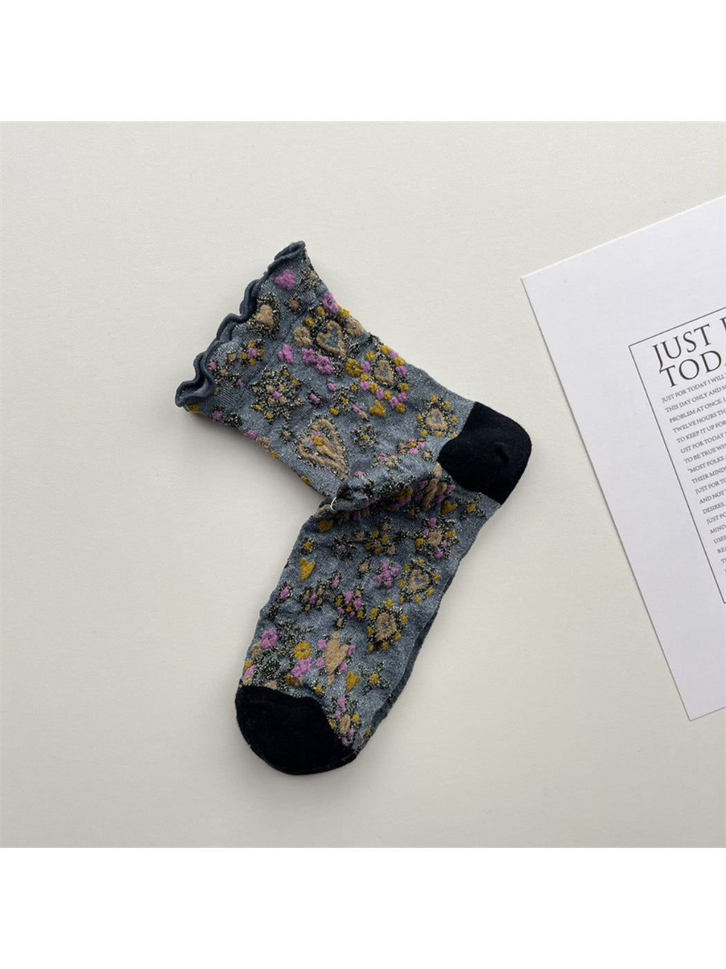 Rufia Heart White Mid-Calf Socks folded neatly with visible heart pattern