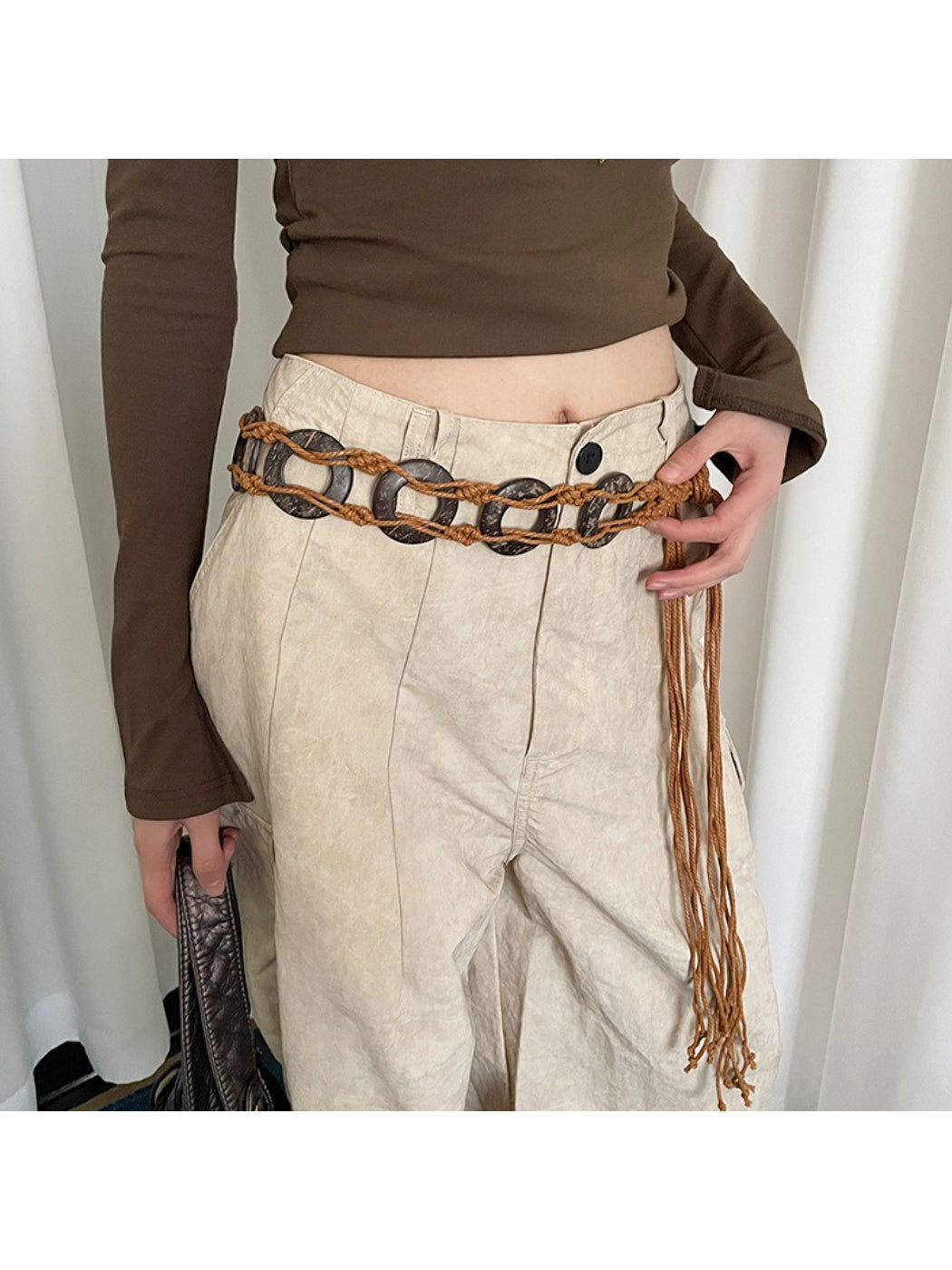 Close-up of Beco Boho woven ring tie waist belt in natural beige color