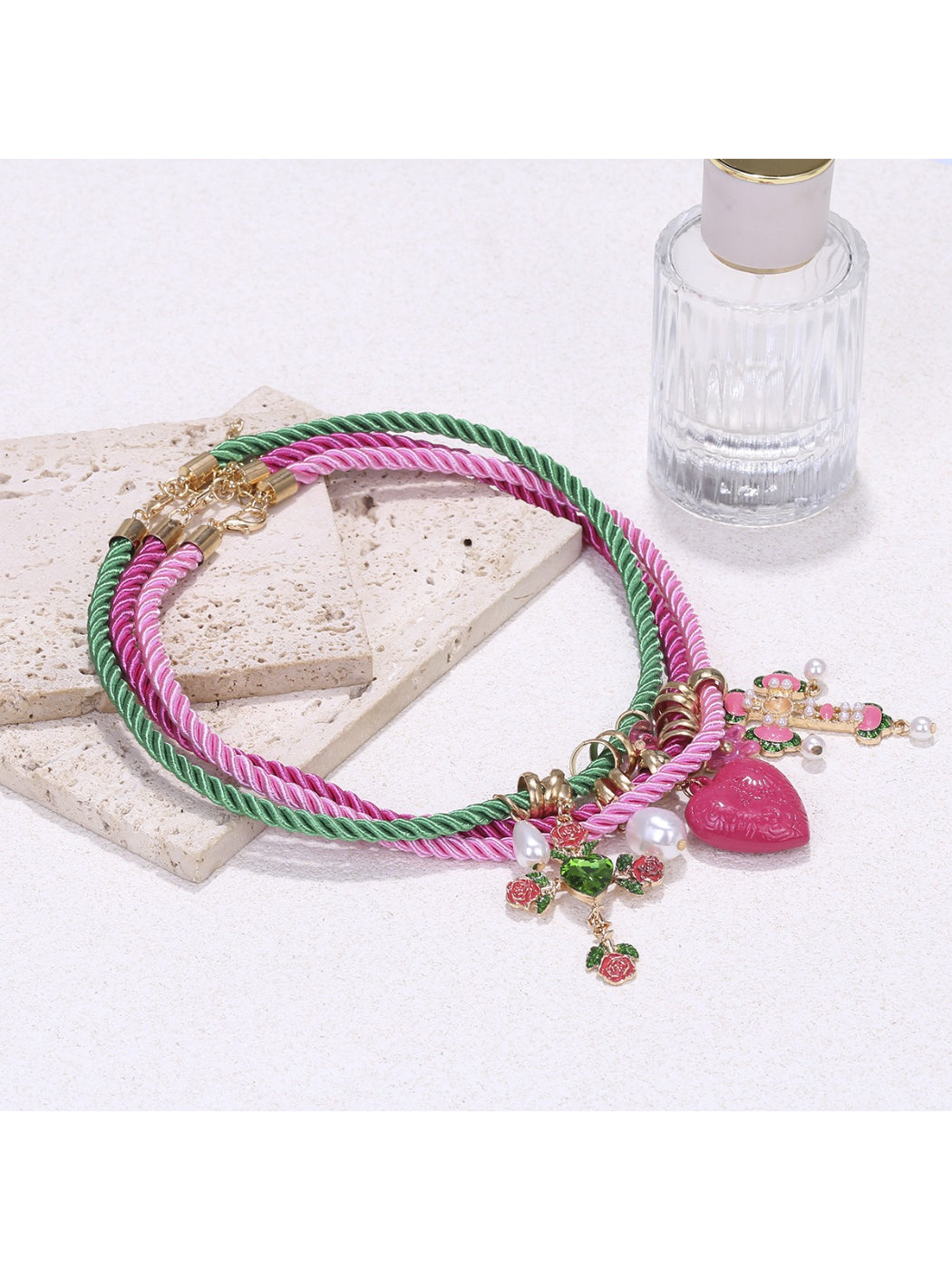Neckit color rope charm necklace with heart detail displayed on white background