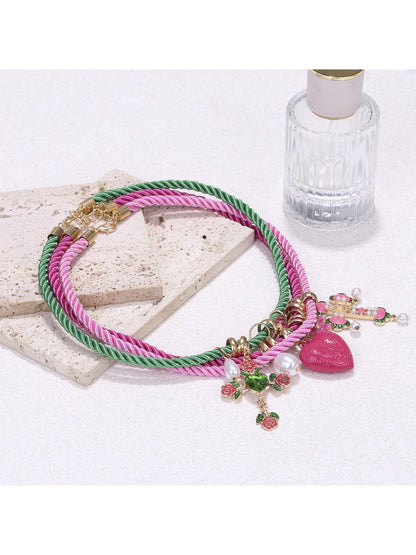 Neckit color rope charm necklace with heart detail displayed on white background