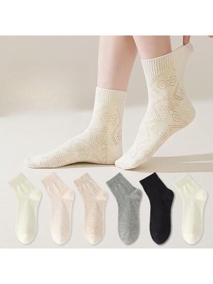 Rufia Pointelle Ribbon Crew Socks in cream color with delicate open-knit pattern