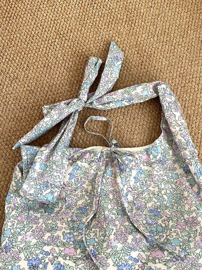 Cosbai boho tie strap sling tote bag styled with casual summer outfit