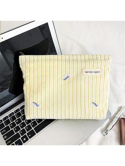 Side view of Cosbai Soft Stripe Makeup Pouch highlighting shape and stripes