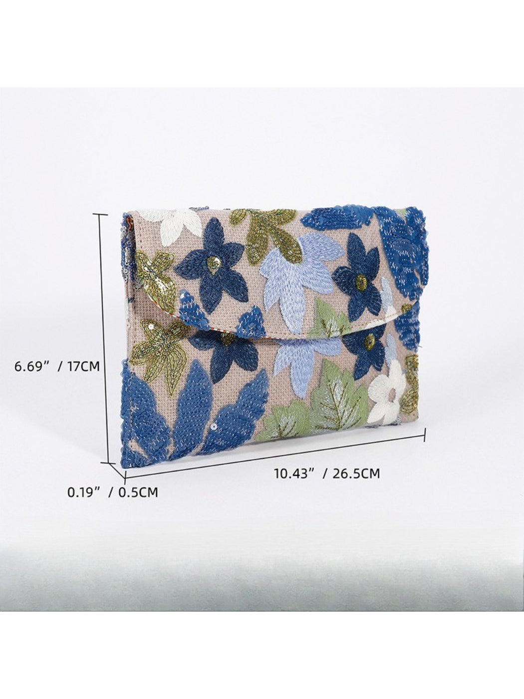 Side view of Cosbai floral clutch bag showing slim profile and clasp