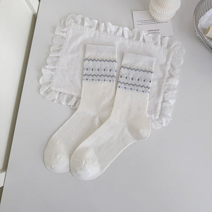 Rufia blue tone crew socks paired with denim jeans