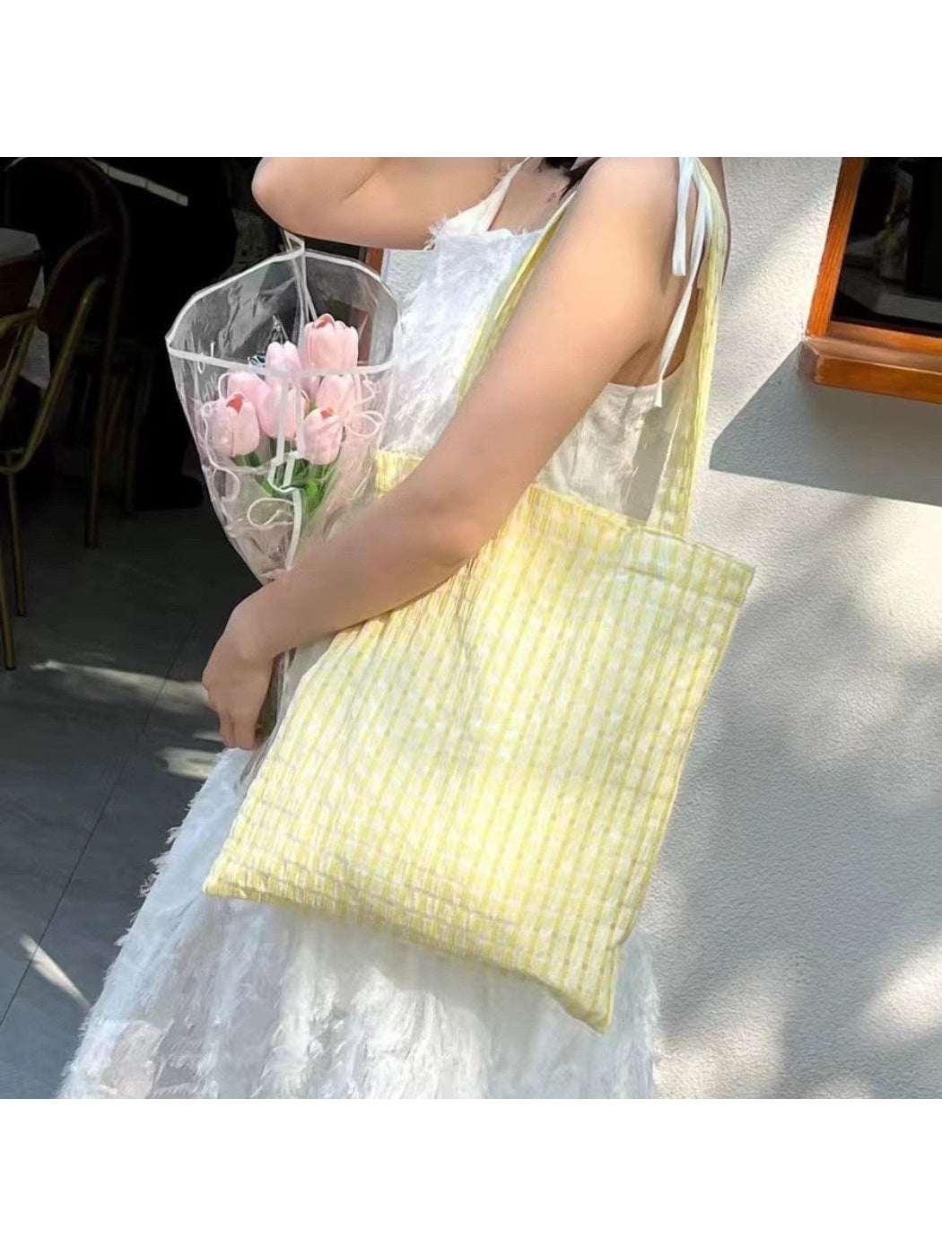 Side view of Cosbai check shopper tote highlighting slim profile and fabric texture