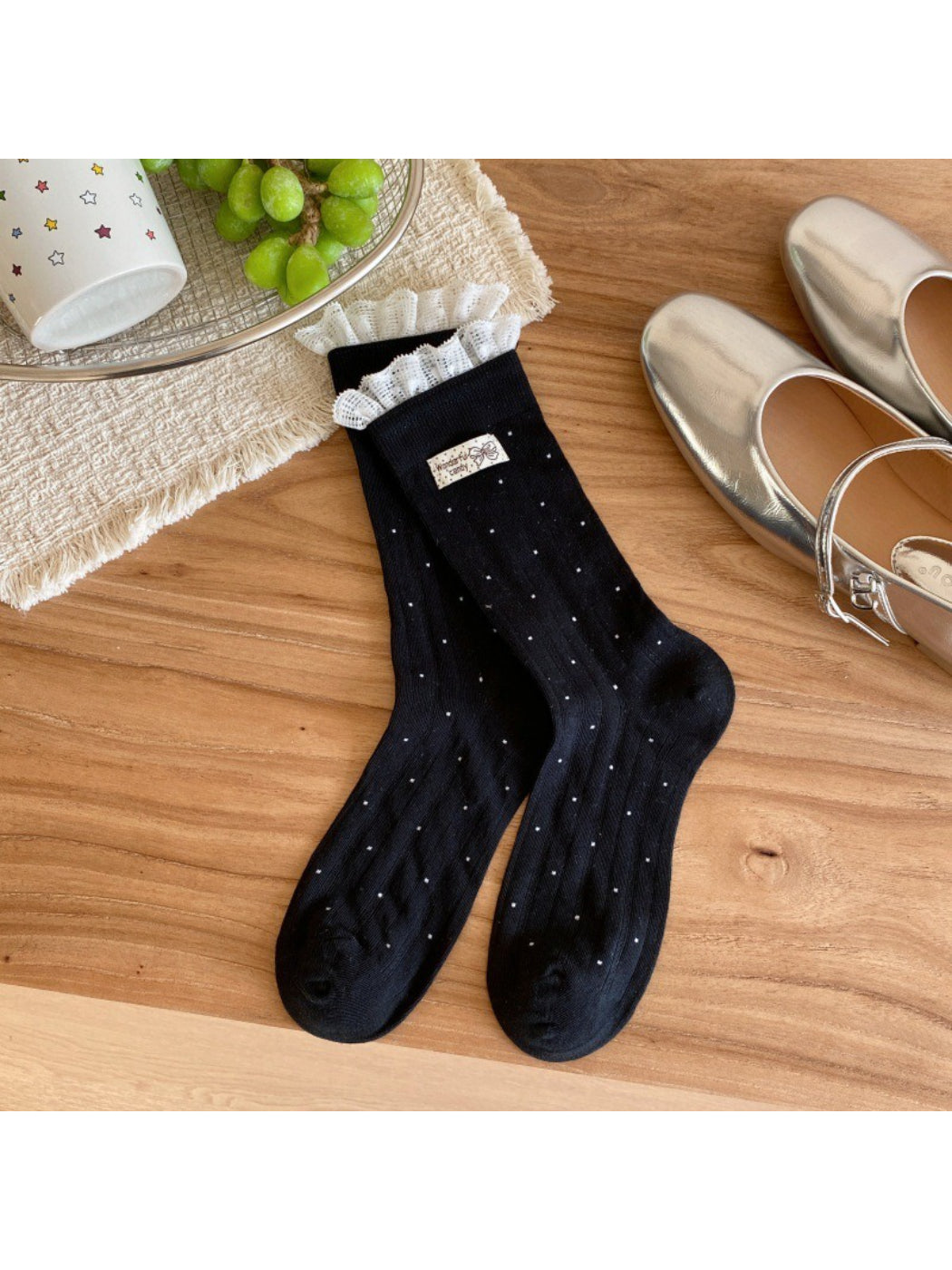 Close-up of sock cuff showing ribbed knit and polka dot design