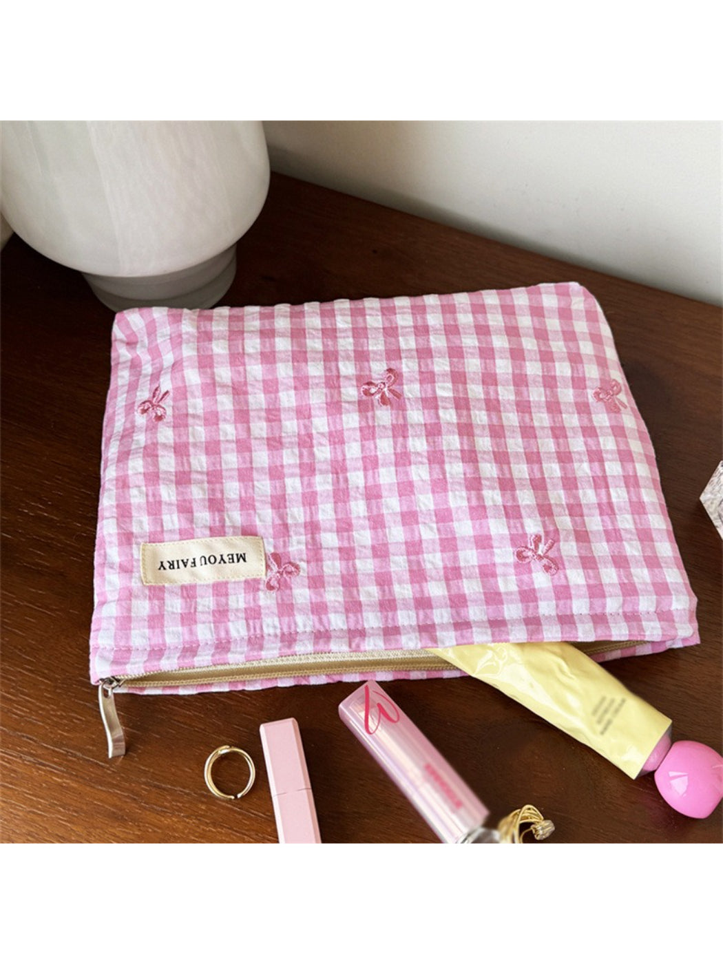 Close-up of Cosbai pastel check zip pouch showing fabric texture and zipper
