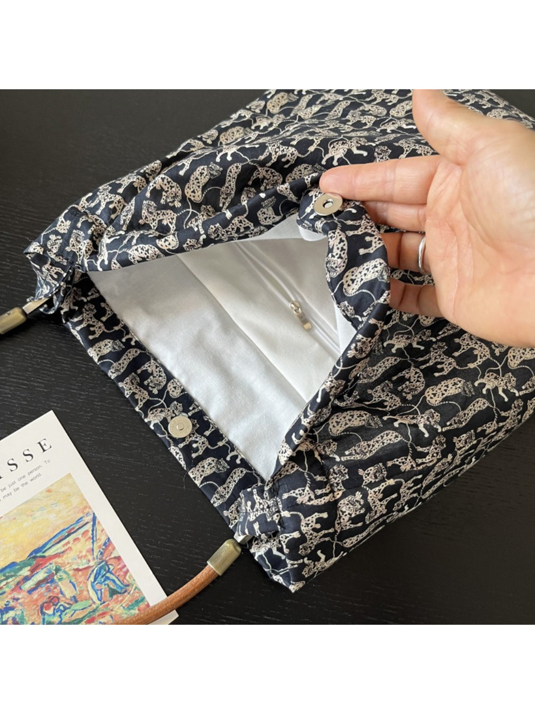 Top view of Cosbai black shoulder bag and cat print