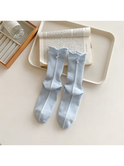 Rufia simple rib crew socks in neutral color with delicate bead embellishments on fabric
