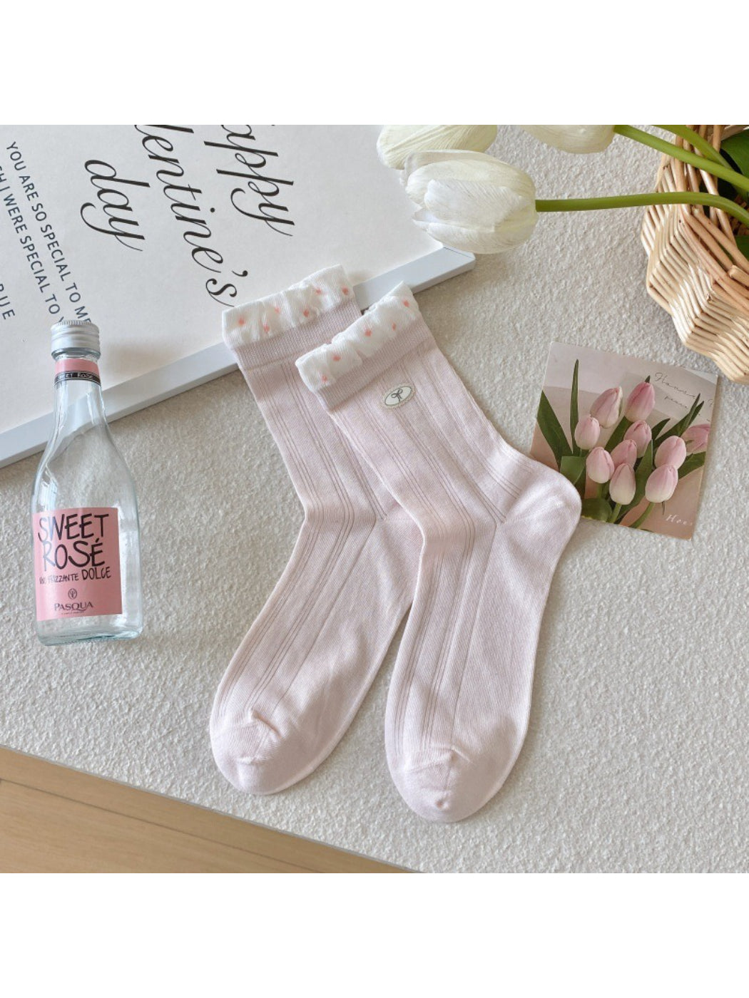 Rufia socks paired with a feminine outfit featuring a skirt and sneakers