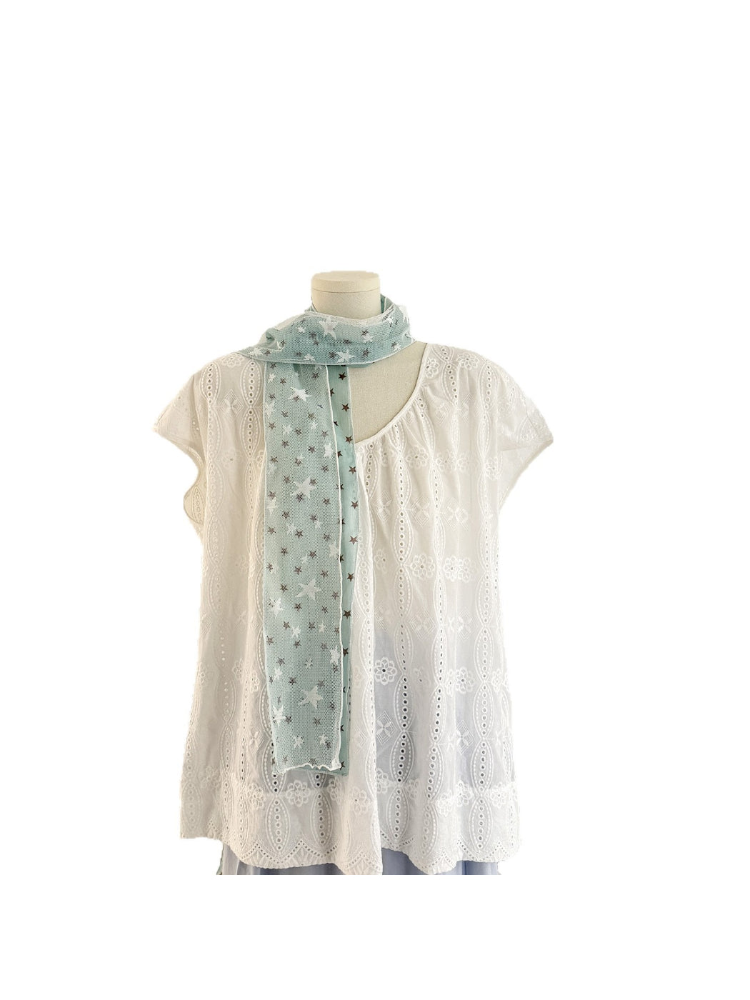 Model wearing Scarvii sheer star print scarf styled around the neck