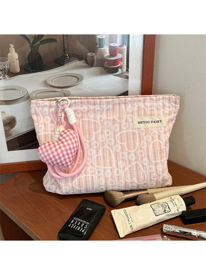 Cosbai cosmetic pouch open with makeup brushes and products inside