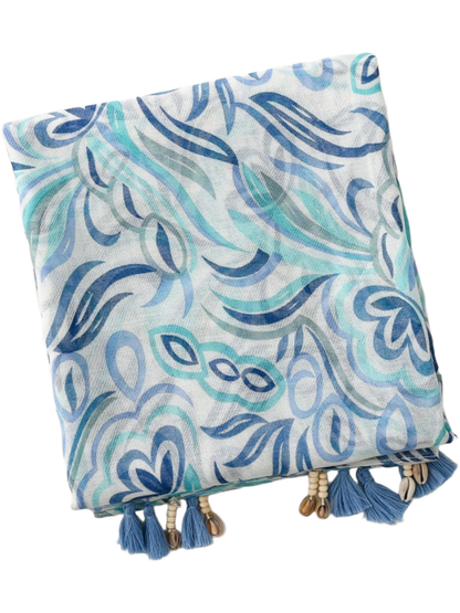 Blue scarf folded compactly, showing curved leaf motifs and clustered tassels and bead details