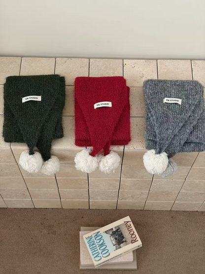 Green, Red and Gray scarves displayed side by side with contrasting pom-poms