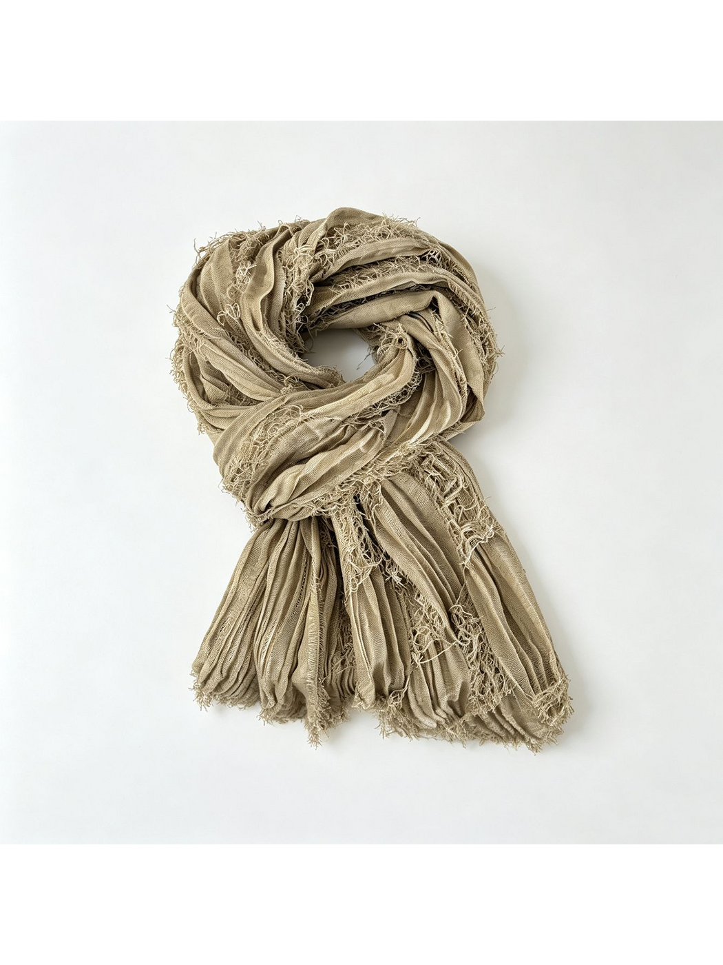 Tan textured scarf arranged in a loop with openwork bands and fringed ends