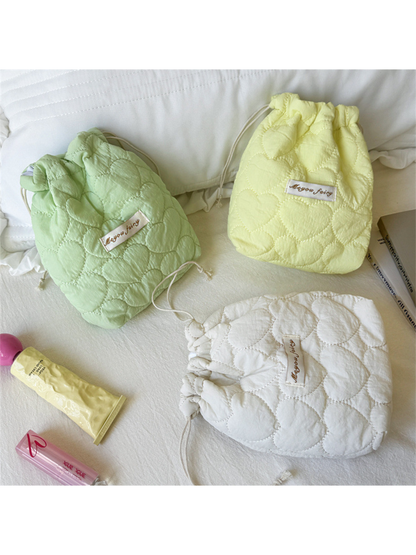 Mint, Yellow and Ivory heart-quilted drawstring pouches displayed together