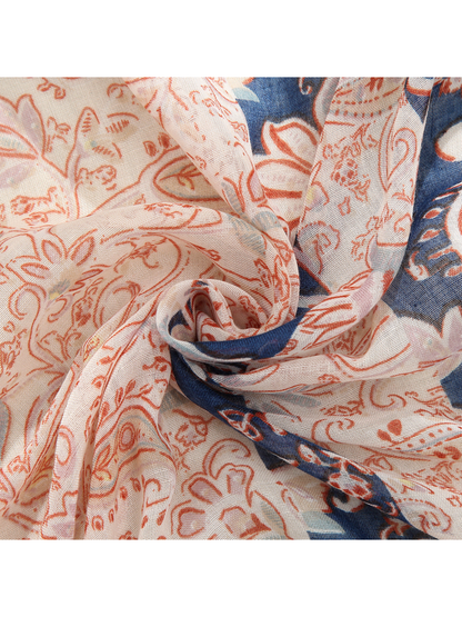 Close-up of cream, coral and navy paisley fabric gathered into folds