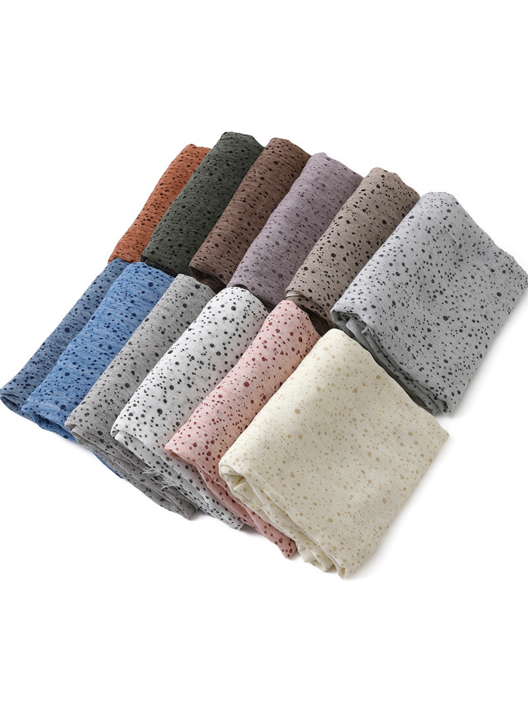 Folded scarves in several colors arranged diagonally on a white background