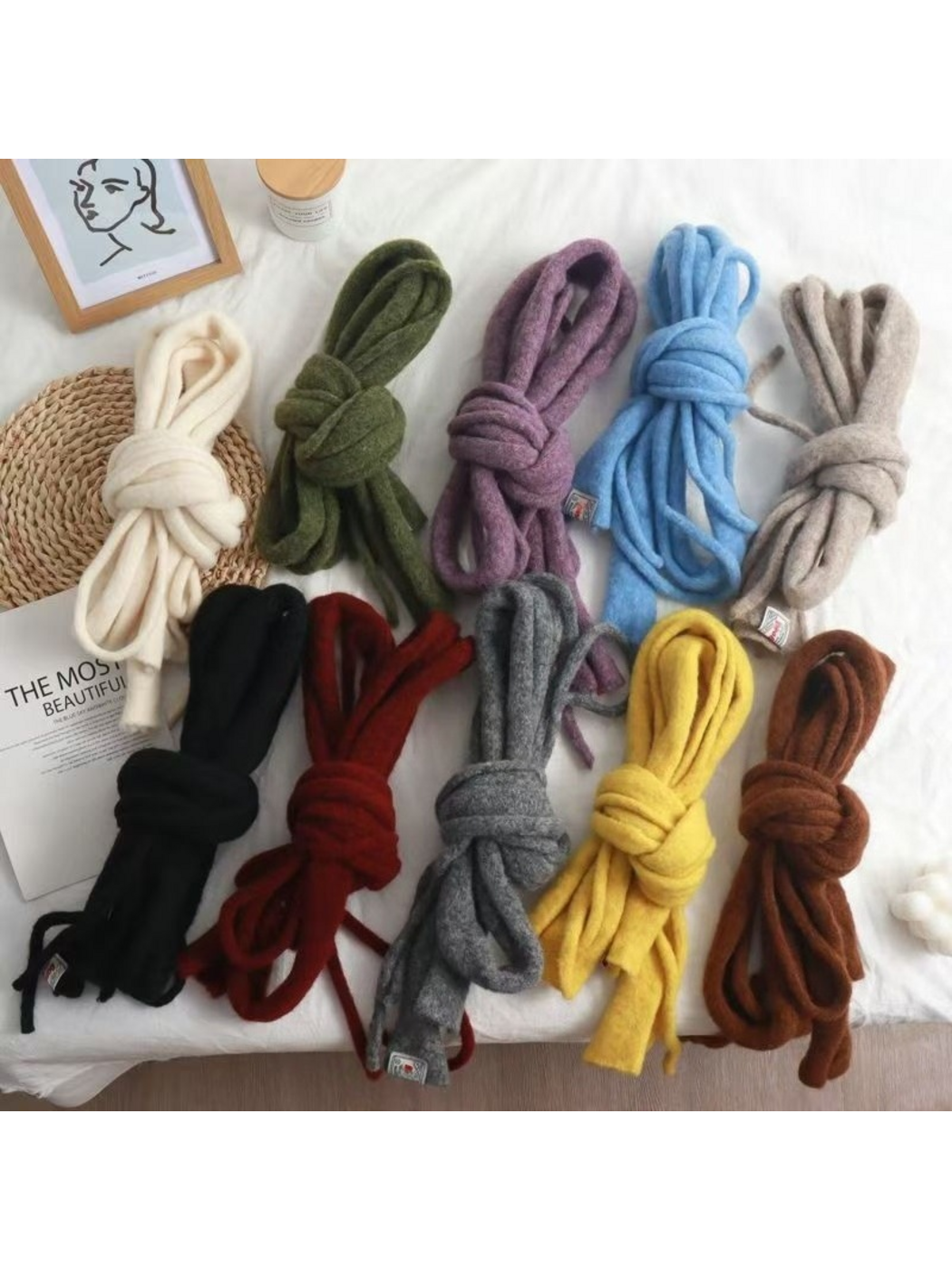 Fuzzy narrow scarves in several colors folded and tied in loose knots