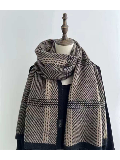 Black plaid scarf with dark borders draped on a mannequin