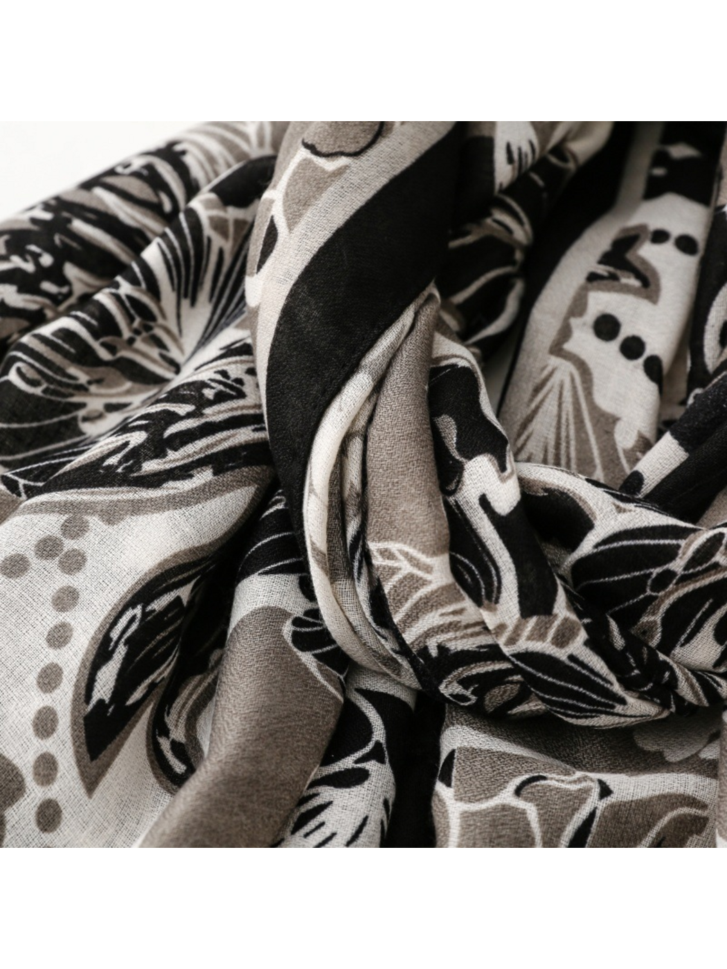 Close-up of the floral scarf gathered into deep folds