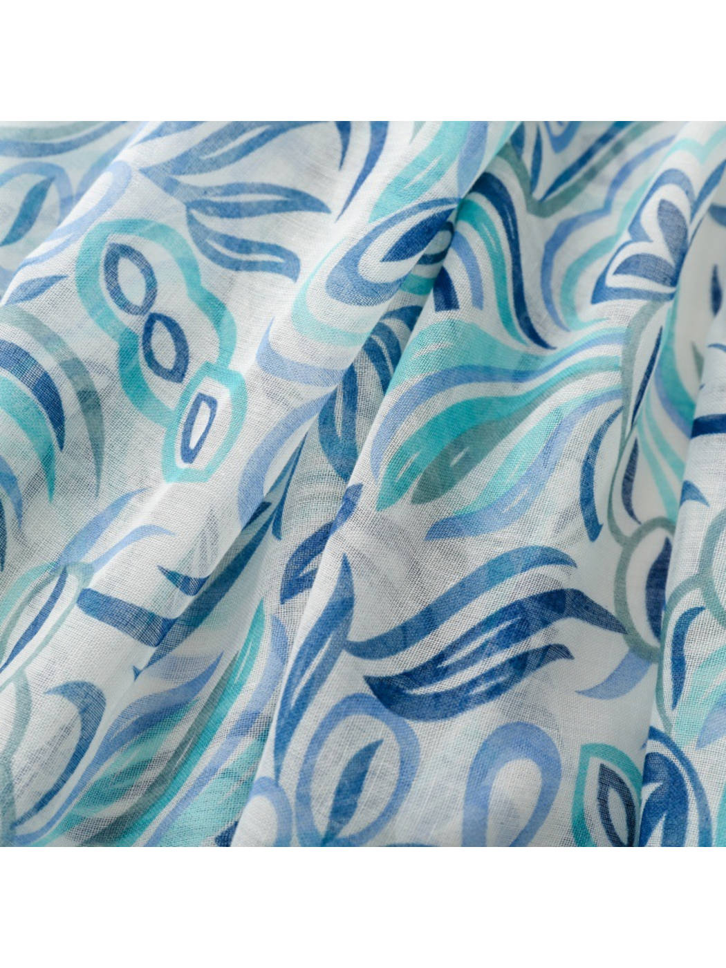 Close-up of the Blue scarf's curved leaf motifs and visible woven texture