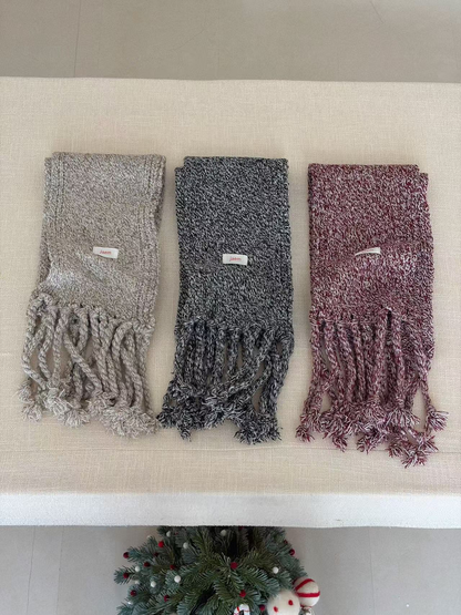 Gray, Black and Burgundy marled knit scarves spaced apart with twisted fringe visible