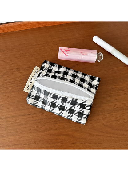 Open Checks makeup bag showing light gray lining