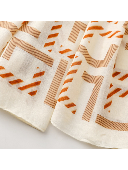 Close-up of angular scarf motifs beside the plain finished border