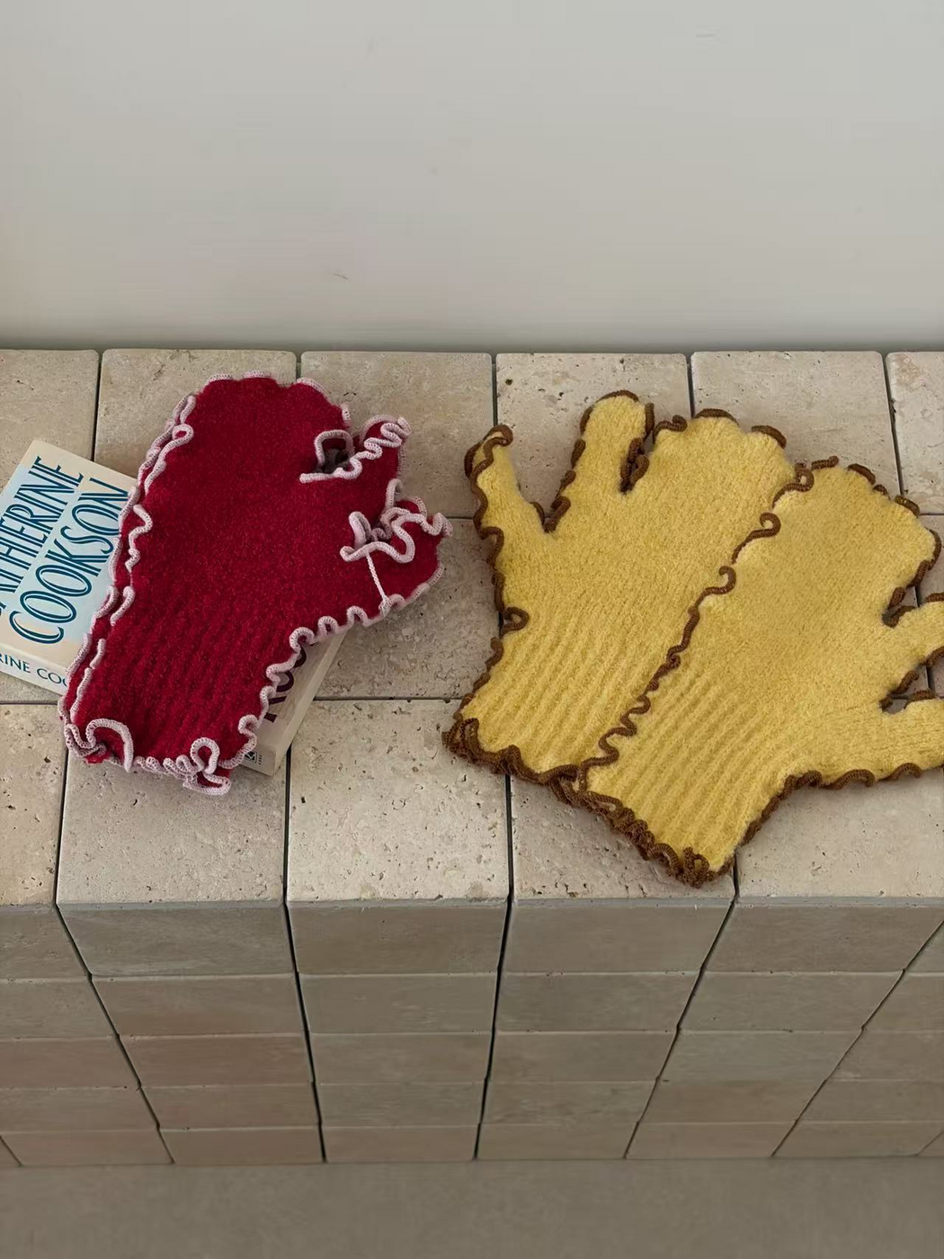 Red and Yellow mittens showing ribbed cuffs, split-finger sections and contrasting ruffled edges