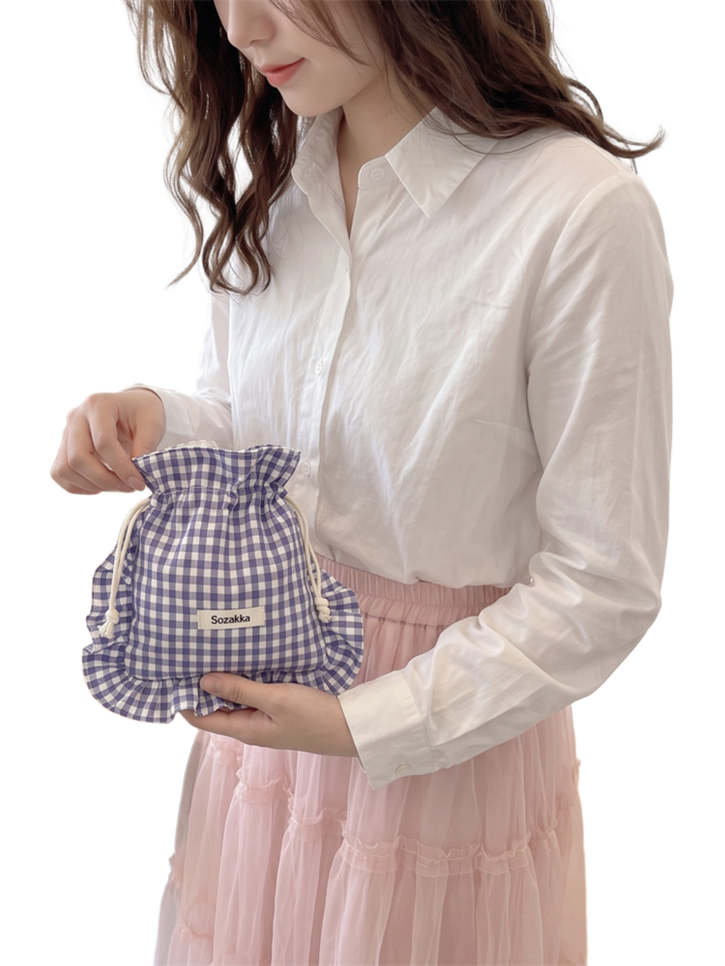 Purple gingham drawstring pouch held at the opening and supported underneath