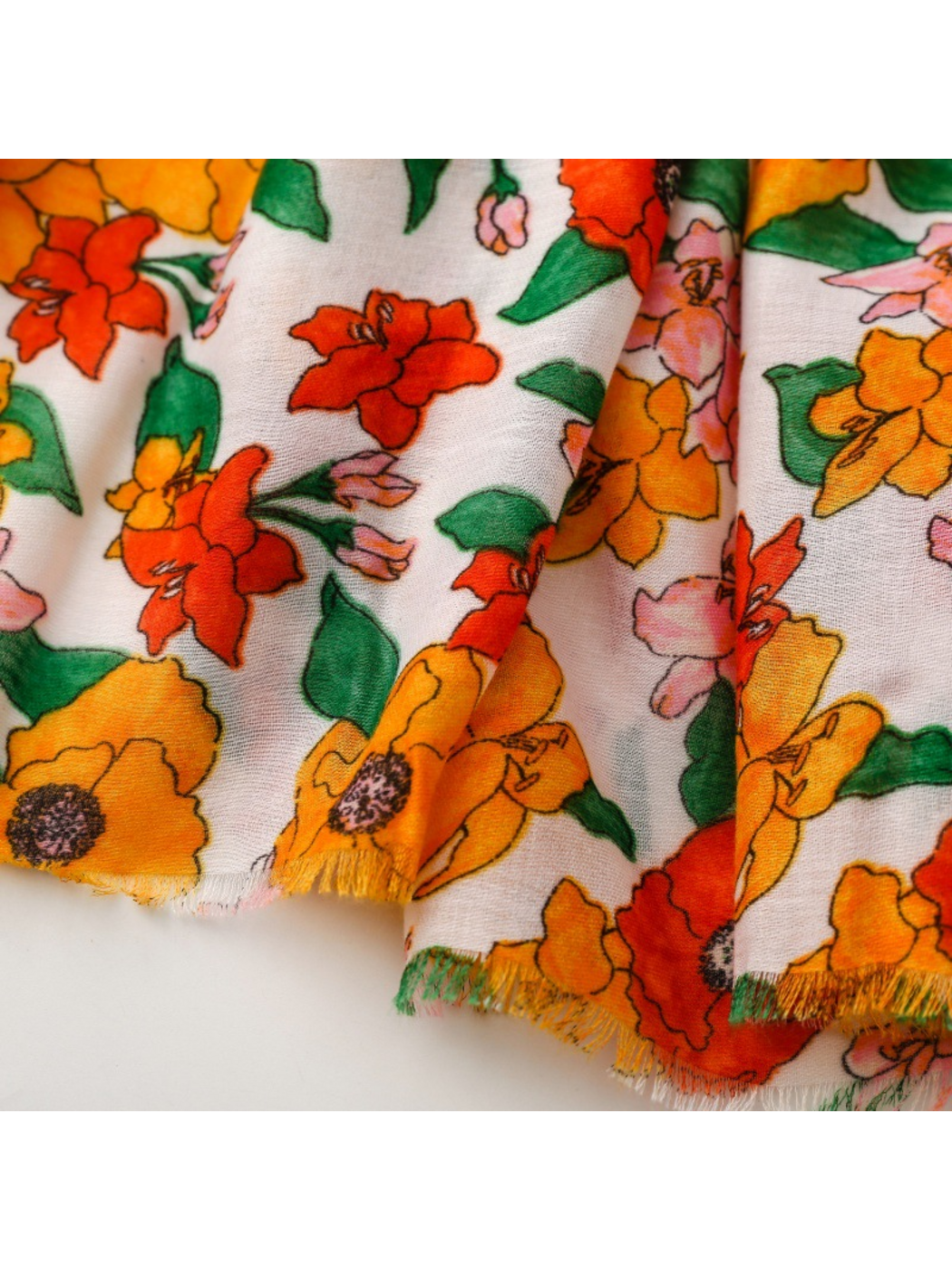 Close-up of floral scarf folds and short fringed edges