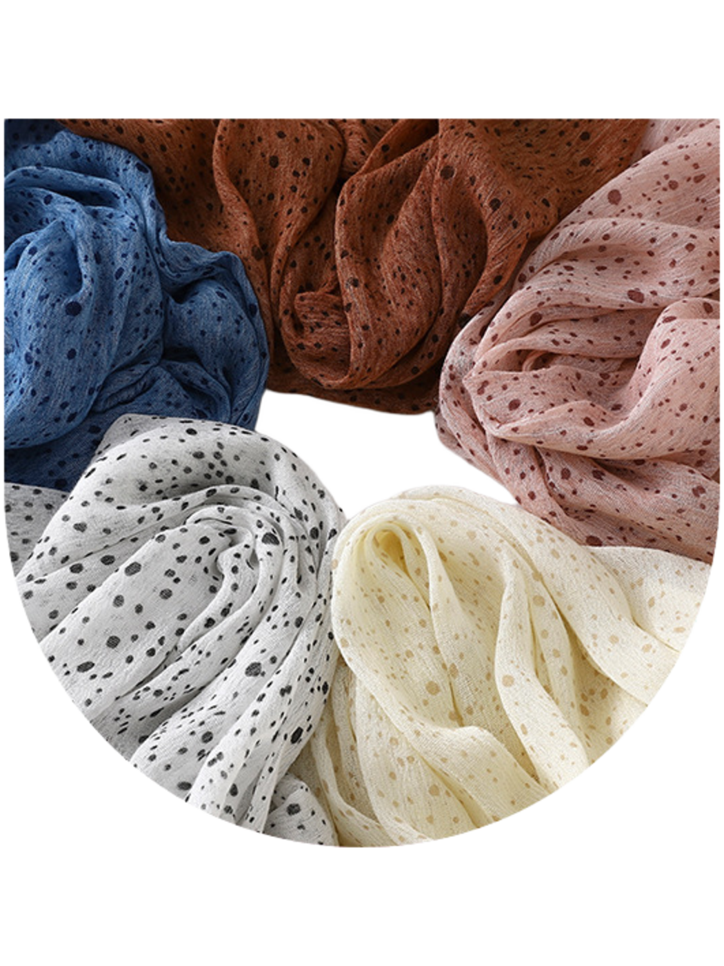 Close-up of blue, caramel, pink, white and ivory scarves arranged in loose folds