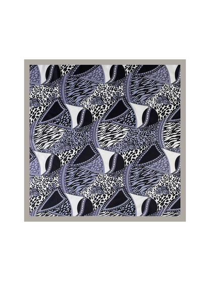Gray square scarf laid flat, showing animal-print patchwork and a contrasting gray border
