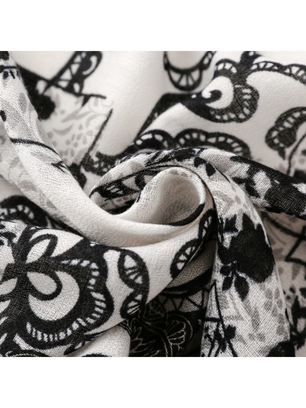 Close-up of the floral scarf gathered into curved folds