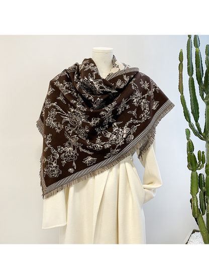Brown floral triangle scarf draped around a mannequin with a looped neckline